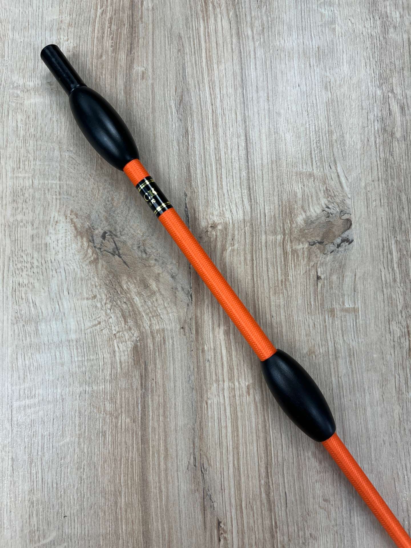 Fleck Balance Gerte orange mit schwarzen Holzknubbeln