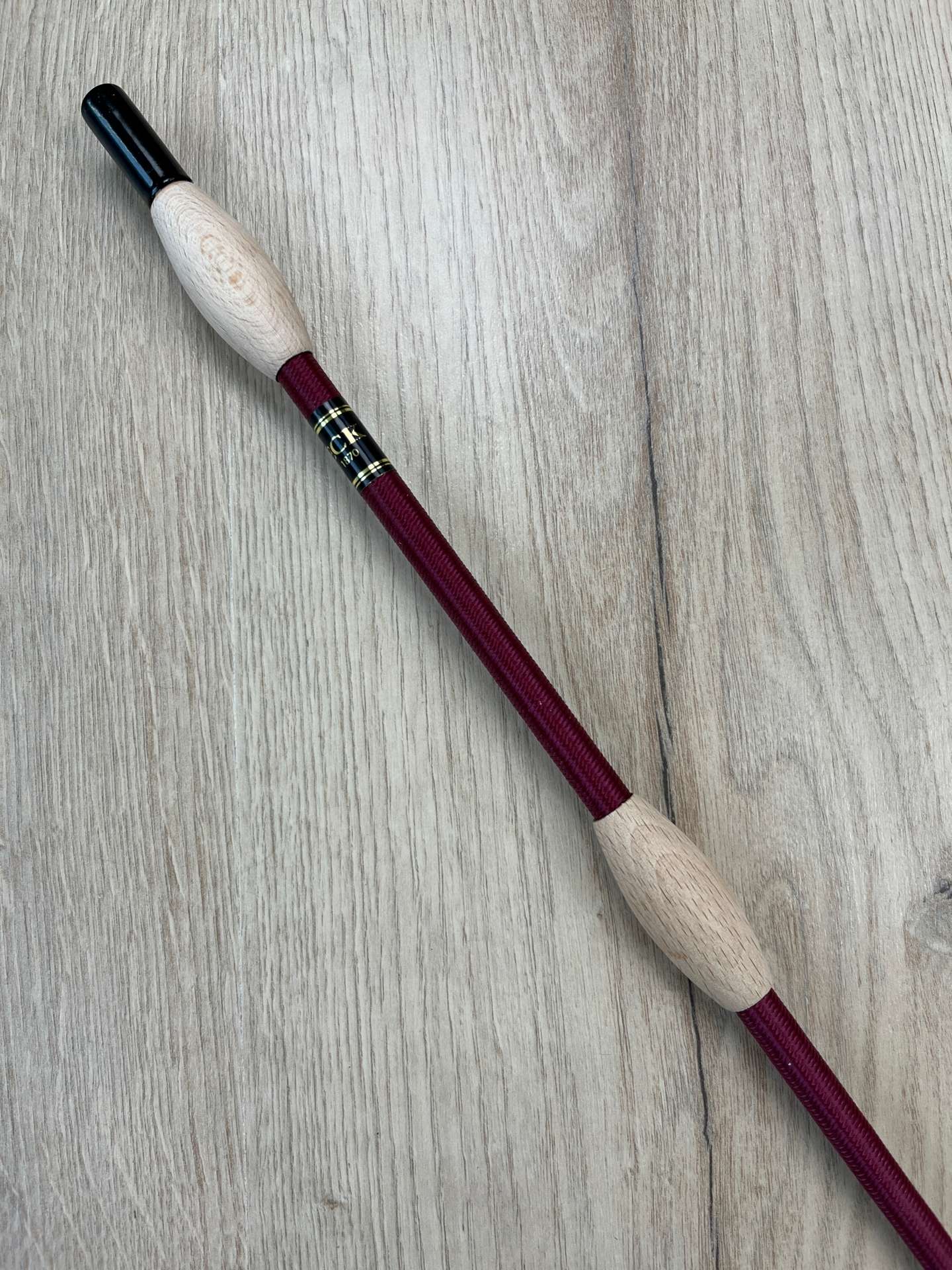 Fleck Balance Gerte weinrot mit Naturholz-Knubbeln